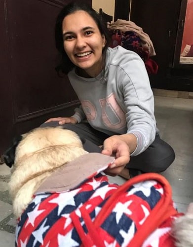 Aashna Chaudhary with a dog