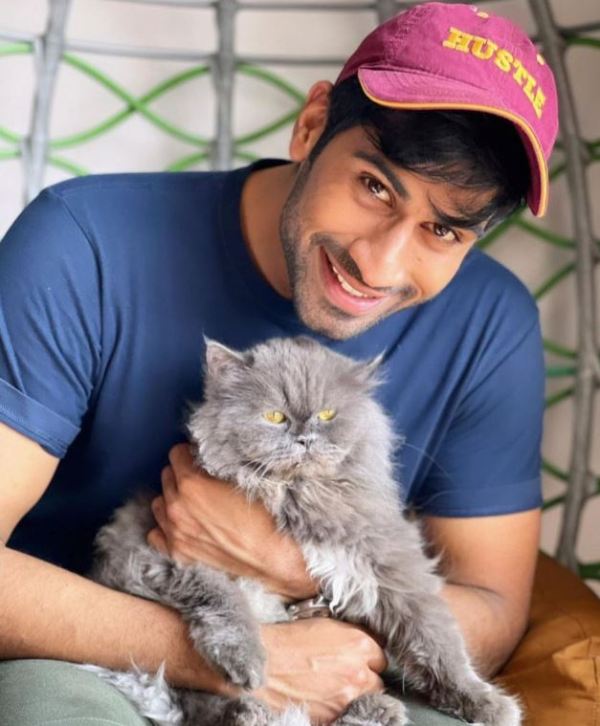 Aman Maheshwari with his pet cat, Popo