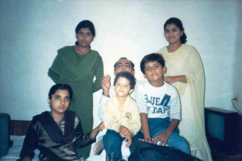 An old picture of Munawwar Rana with his children