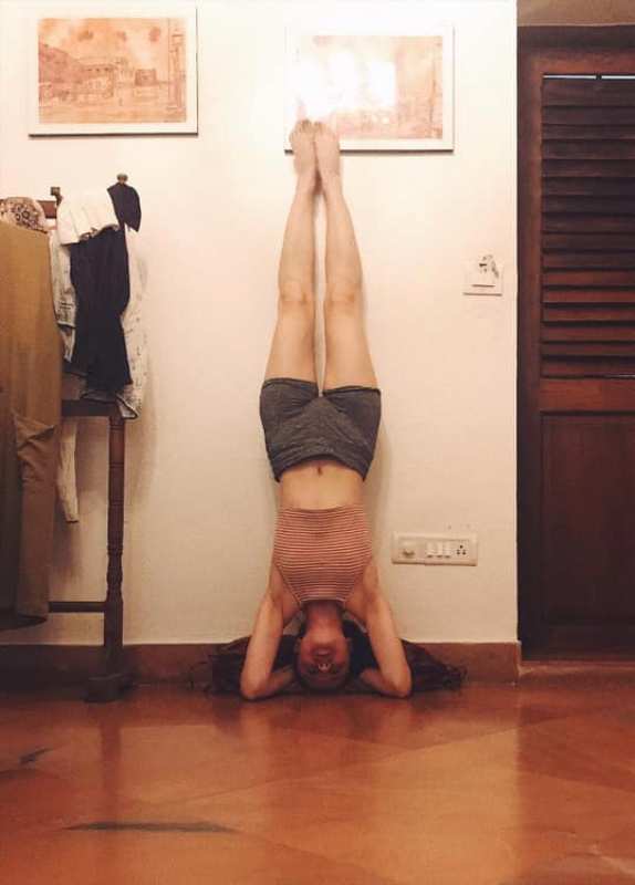 Anna Ador doing a headstand