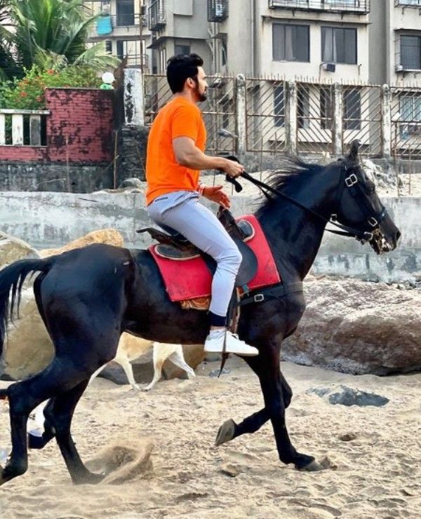 Bhushan Pradhan riding a horse