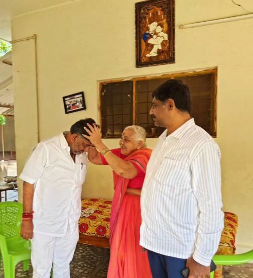 D.K. Shivakumar with his mother, Gouramma, and younger brother, D. K. Suresh