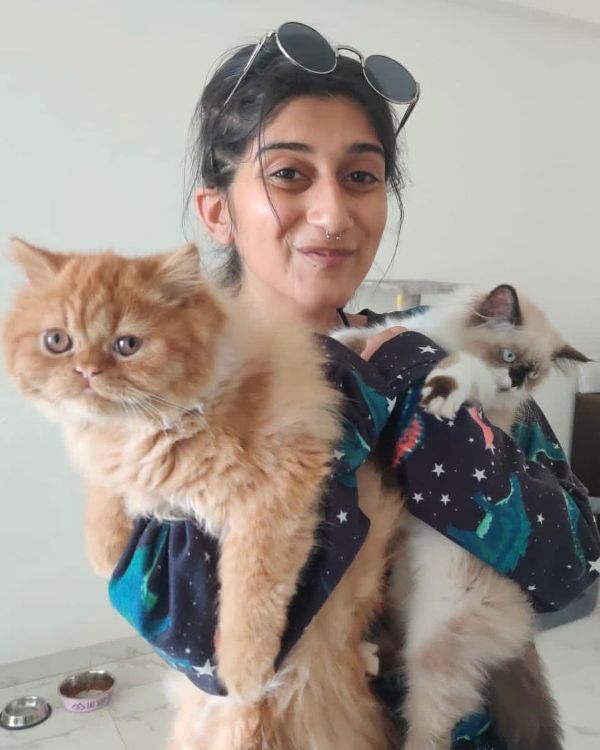 Deeksha Joshi with her pet cats, Myo (left) and Ponyo (right)