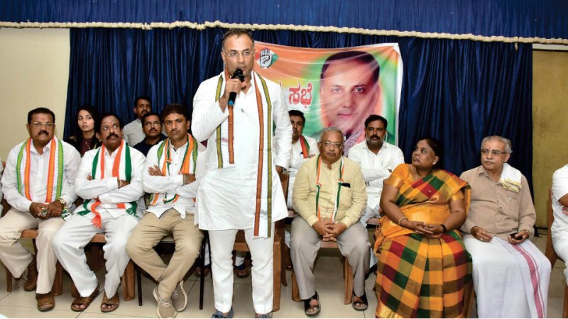 Dinesh Gundu Rao, along with other Congress leaders, during a political campaign