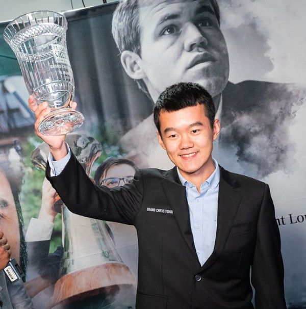 Ding Liren holding the Grand Chess Tour trophy