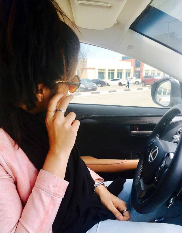 Jumana Khan sitting in her Lexus car