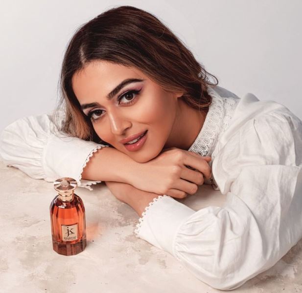 Jumana Khan with a perfume from her collection