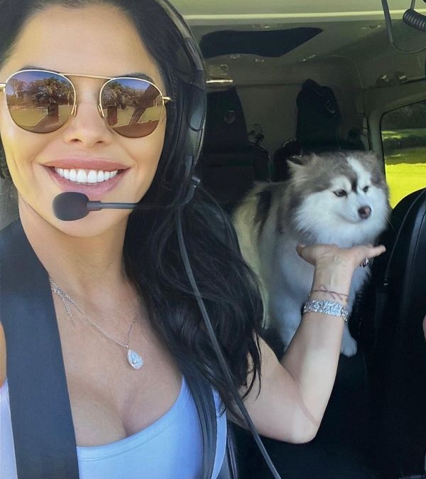 Lauren with Blu in a helicopter