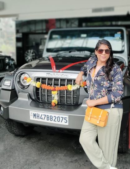 Neha Saraf posing with her Thar