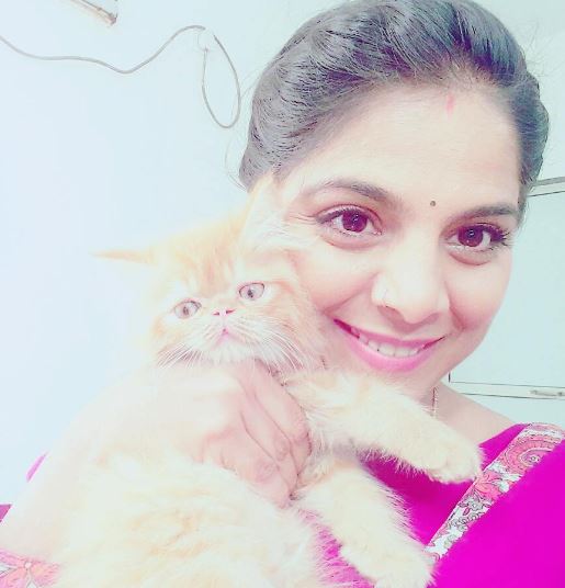 Neha Saraf with a cat