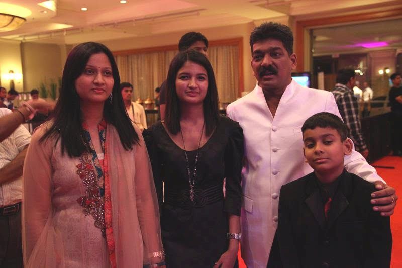 Nitin Chandrakant Desai with his wife and children