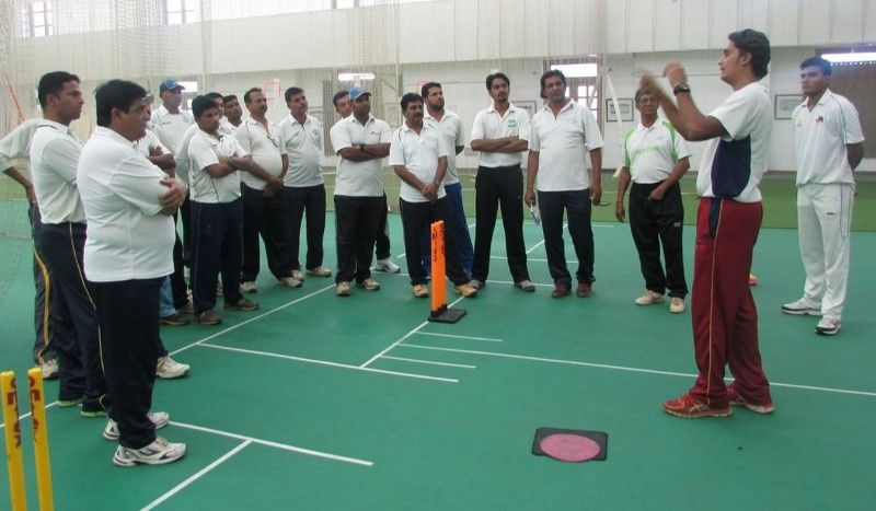 Omkar Salvi giving bowling tips to players at Sharad Pawar Cricket Academy