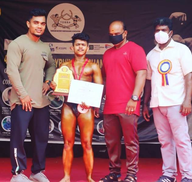 Praveen Nath with his mentor (left) after winning the Mr Thrissur title