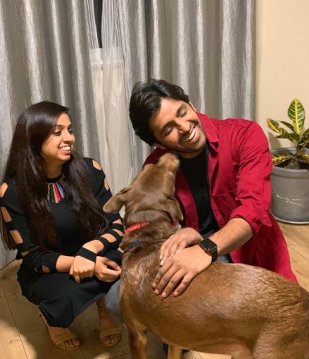 Priyadarshi Pulikonda with his wife and pet dog