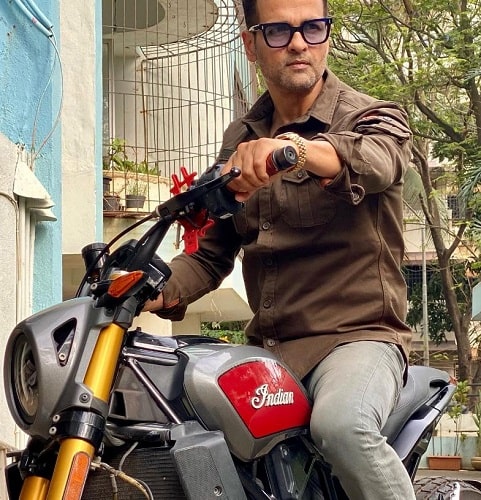 Rohit Roy posing on his motorcycle