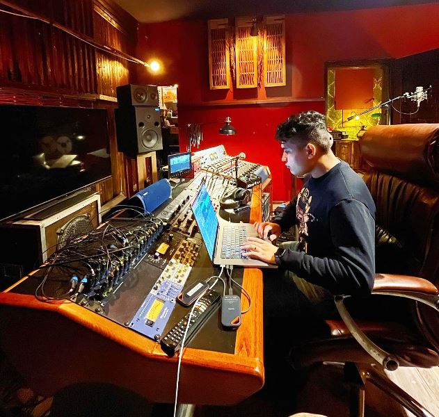 Shashwat Sachdev composing music in a studio
