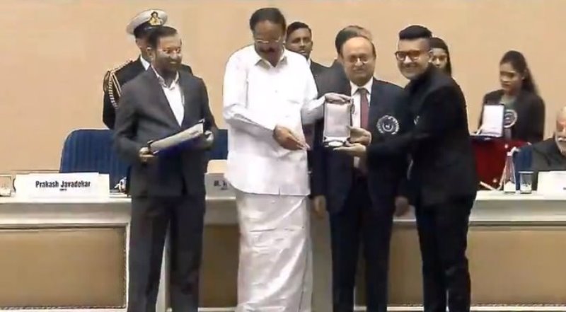 Shashwat Sachdev receving National Film Award for Best Music Direction from Vice President Venkaiah Naidu in 2019