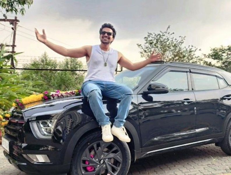 Siddharth Khirid giving a pose with his newly bought Hyundai Creta