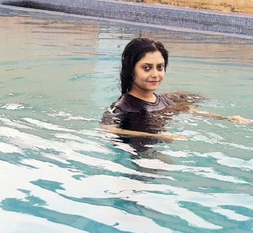 Suchandra Dasgupta swimming in a pool