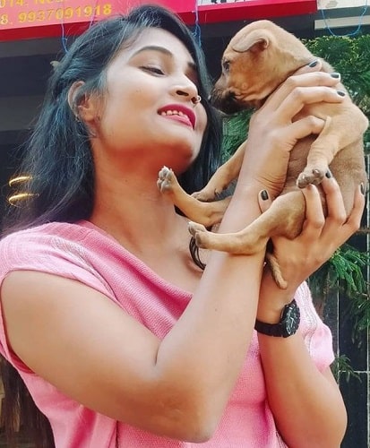 Suman Kumari with a dog