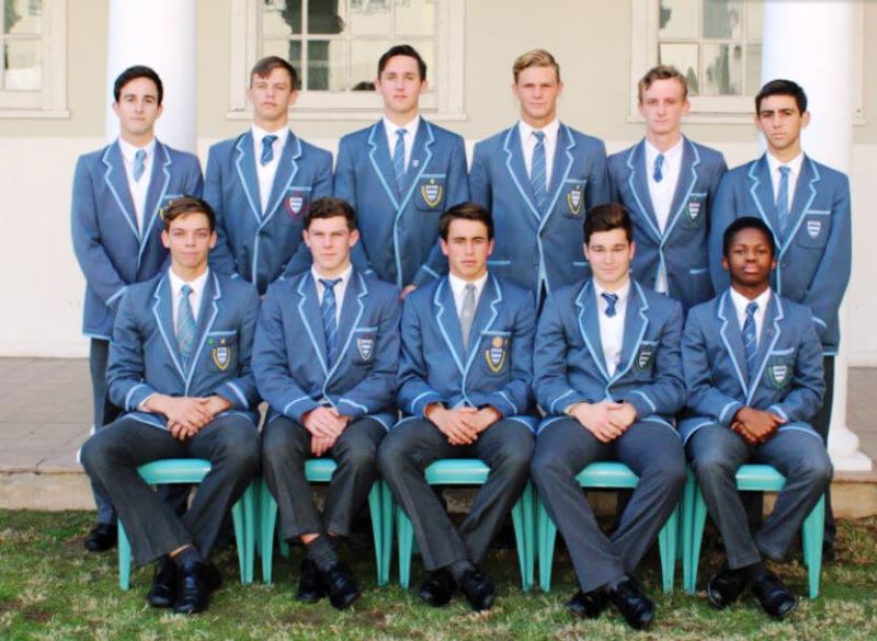 Tristan Stubbs (leftmost in the sitting row) as a part of Port Elizabeth's Grey High School Under-19 Hockey team in 2018