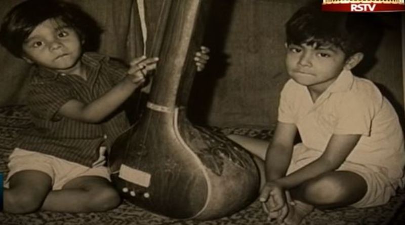 Young Wasifuddin Dagar holding a Sitar