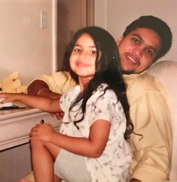 A childhood image of Noor Alfallah with her father