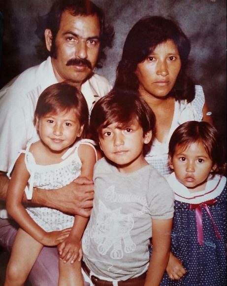 A childhood photo of Rafael Reyes with his family