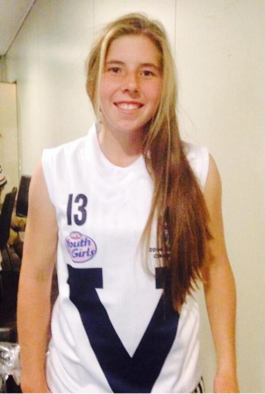 A photograph of Georgia Wareham in her Australian Rules football jersey