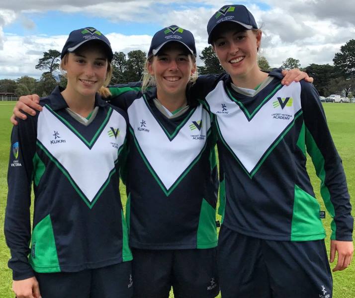 A photograph of Georgia Wareham (middle) with her Victoria Women's teammates