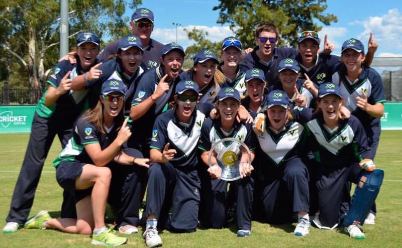 A photograph of Georgia Wareham with the Under-18 team celebrating their victory