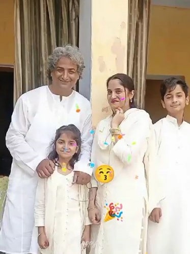 A picture of Azhar Iqbal with his wife and children