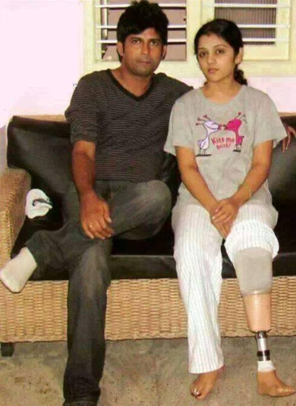 A picture of Pratap Simha with his wife, Arpitha Simha, showing her prosthetic leg