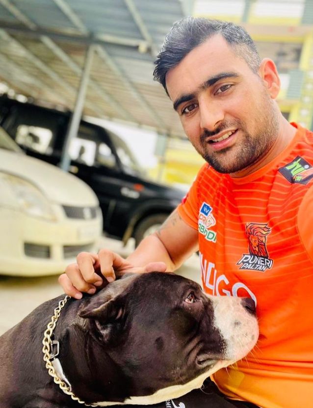 A picture of Rahul with a dog