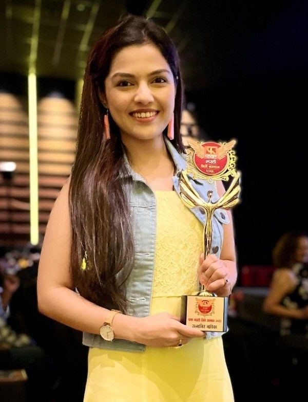 Aarya Ambekar receiving her first award for the song Bai Ga