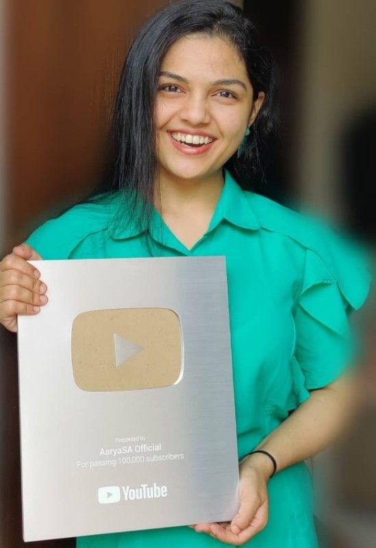 Aarya Ambekar with her YouTube silver play button