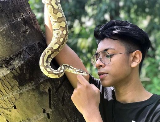 Abhirup Kadam with his pet ball python