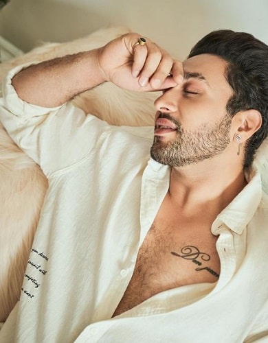 Adhyayan Suman's tattoo on his chest and the back of his left ear