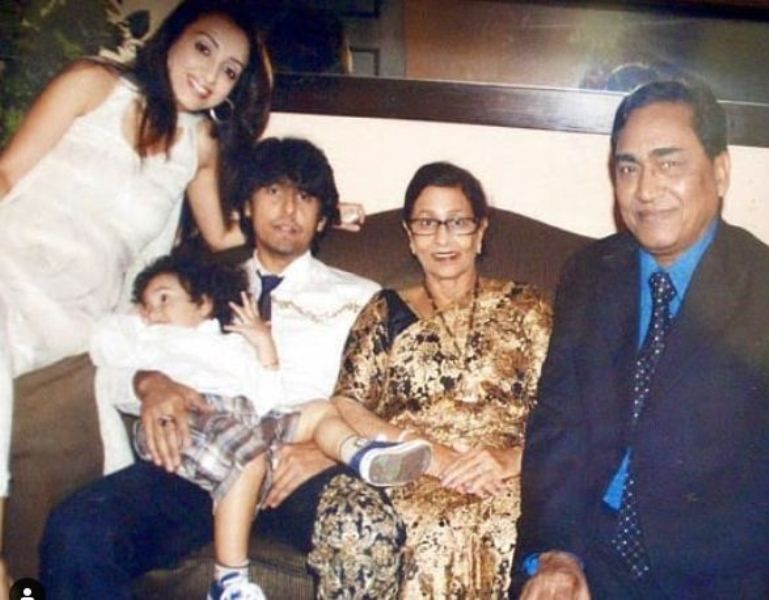 Agam Kumar Nigam with his wife, son, and daughter-in-law (right to left)