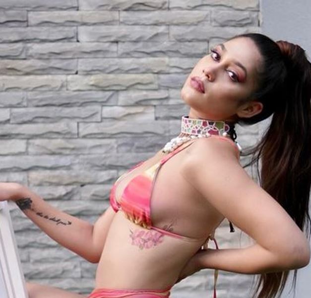 Anushka Mitra's tattoo on the left side of her ribs
