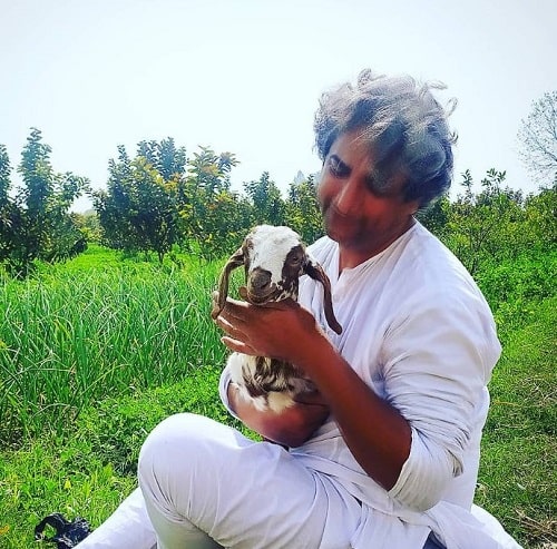 Azhar Iqbal with a goat
