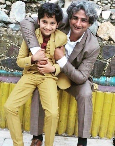 Azhar Iqbal with his son