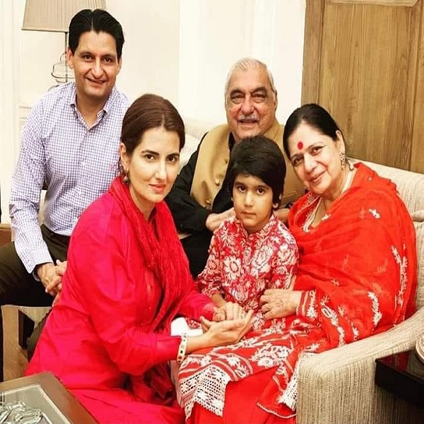 Deepender Singh Hooda with his father, mother, wife, and son