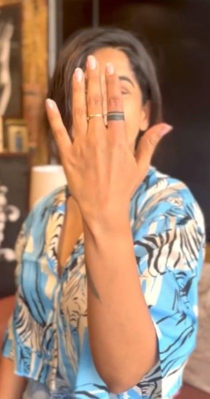 Krishi Thapanda's left-hand index finger tattoo
