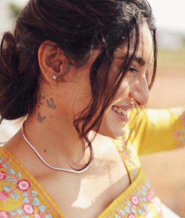 Krishi Thapanda's neck tattoo
