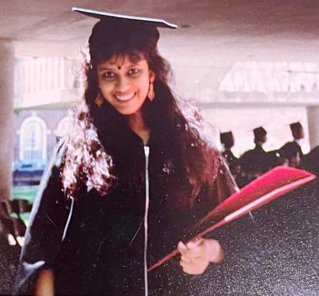 Nandana posing for a photo during her graduation ceremony