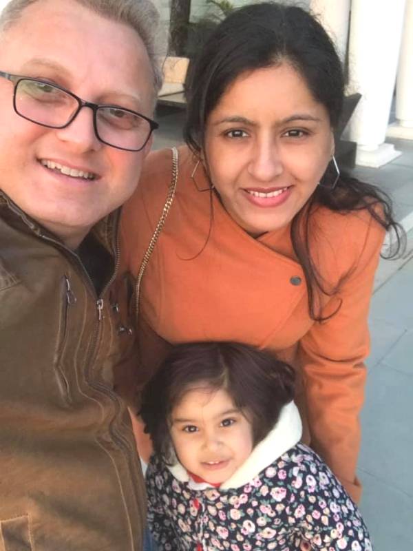 Naresh Kathooria with his wife and daughter