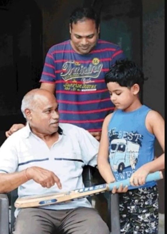 Nikhil Menon with his son, Hrishabh, and father, Narendra