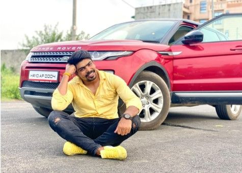 Pawan with his red Range Rover