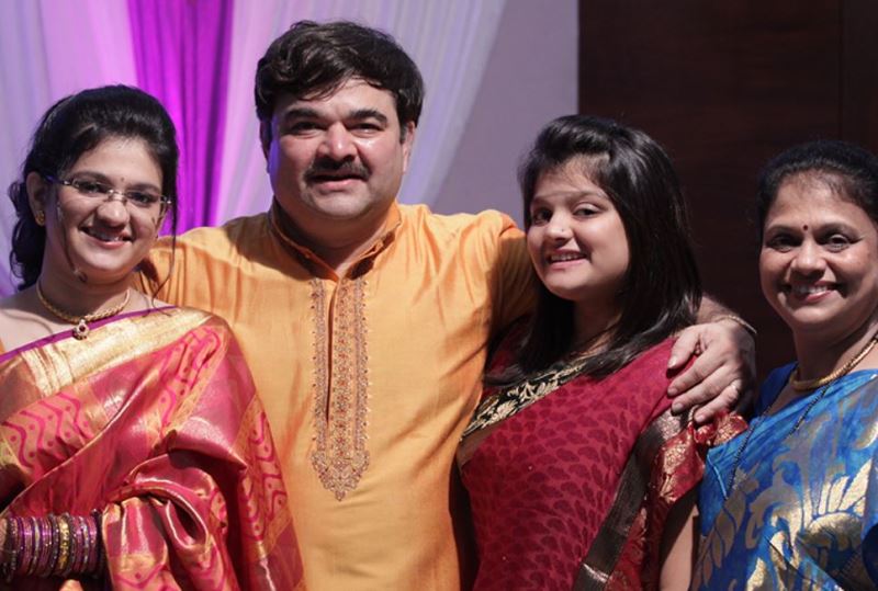 Prashant Damle with his wife and daughters